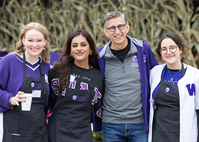 Group of people standing beside each other