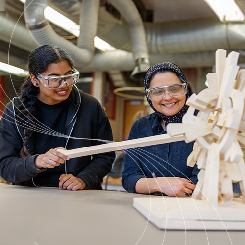 Faculty and staff hugging each other and taking a photo
